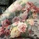 Set of two toad-shaped sofas covered in floral fabric.