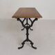 Bistro table with an oak top on a cast iron base, 1930s.