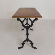 Bistro table with an oak top on a cast iron base, 1930s.