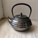 Silver cast iron teapot