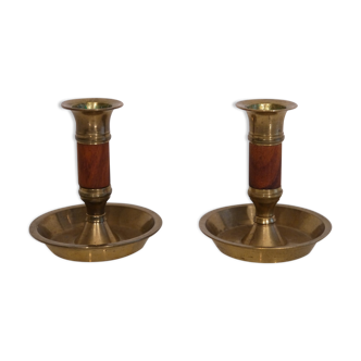 Pair of teak and brass candlesticks