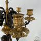 Candelabra with cherub in patinated bronze