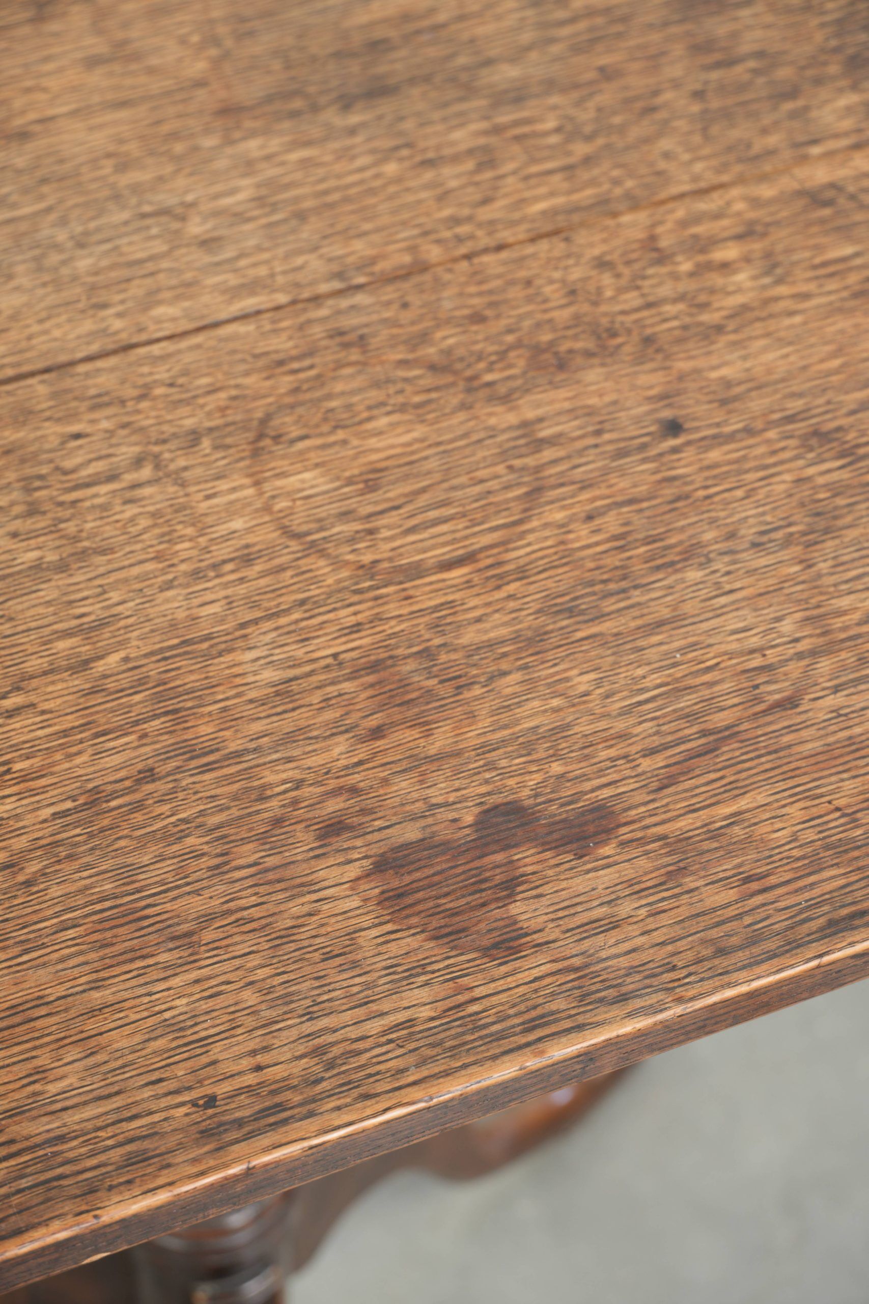 Antique English oak tilt top table from the 19th century in a unique shape