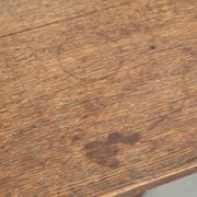 Antique English oak tilt top table from the 19th century in a unique shape