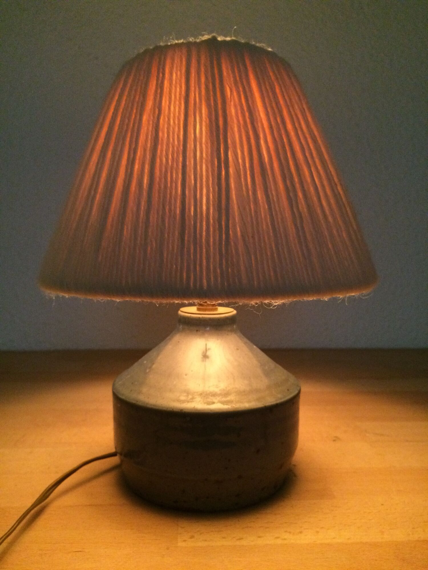 Blue ceramic lamp foot and white wool lampshade