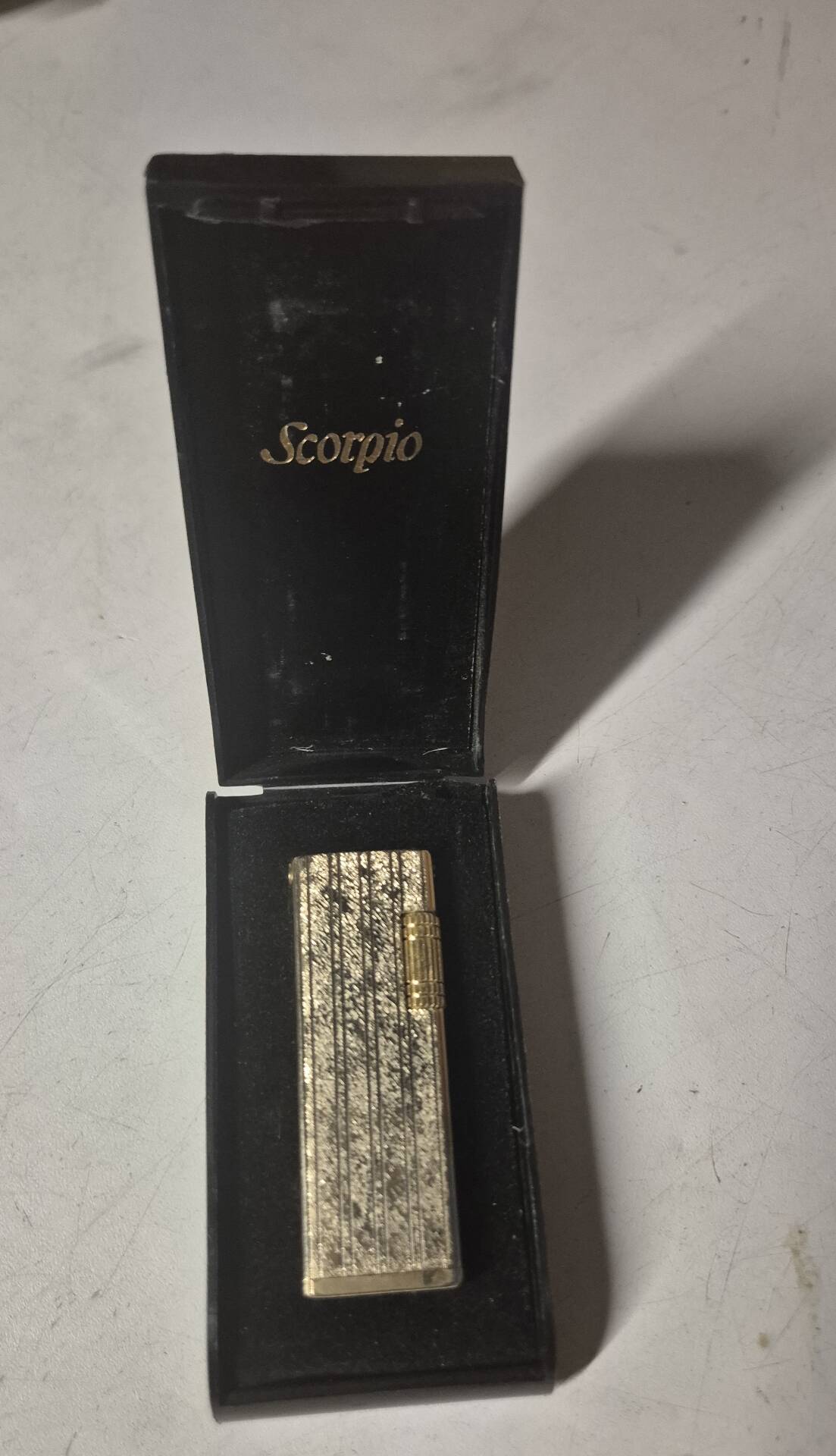 Vintage Scorpio gas lighter in its collector's case.