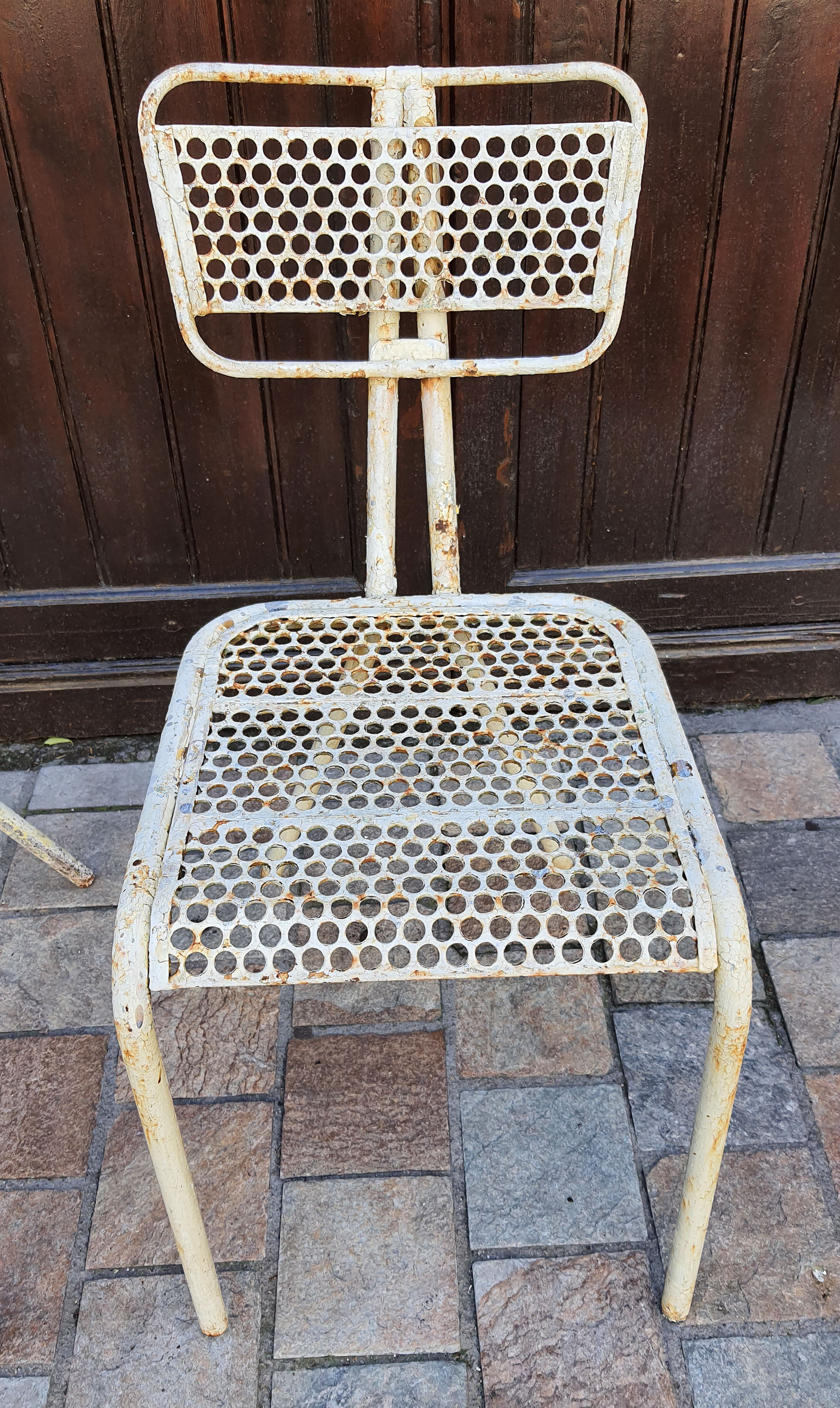 Perforated metal chairs René Malaval 1950