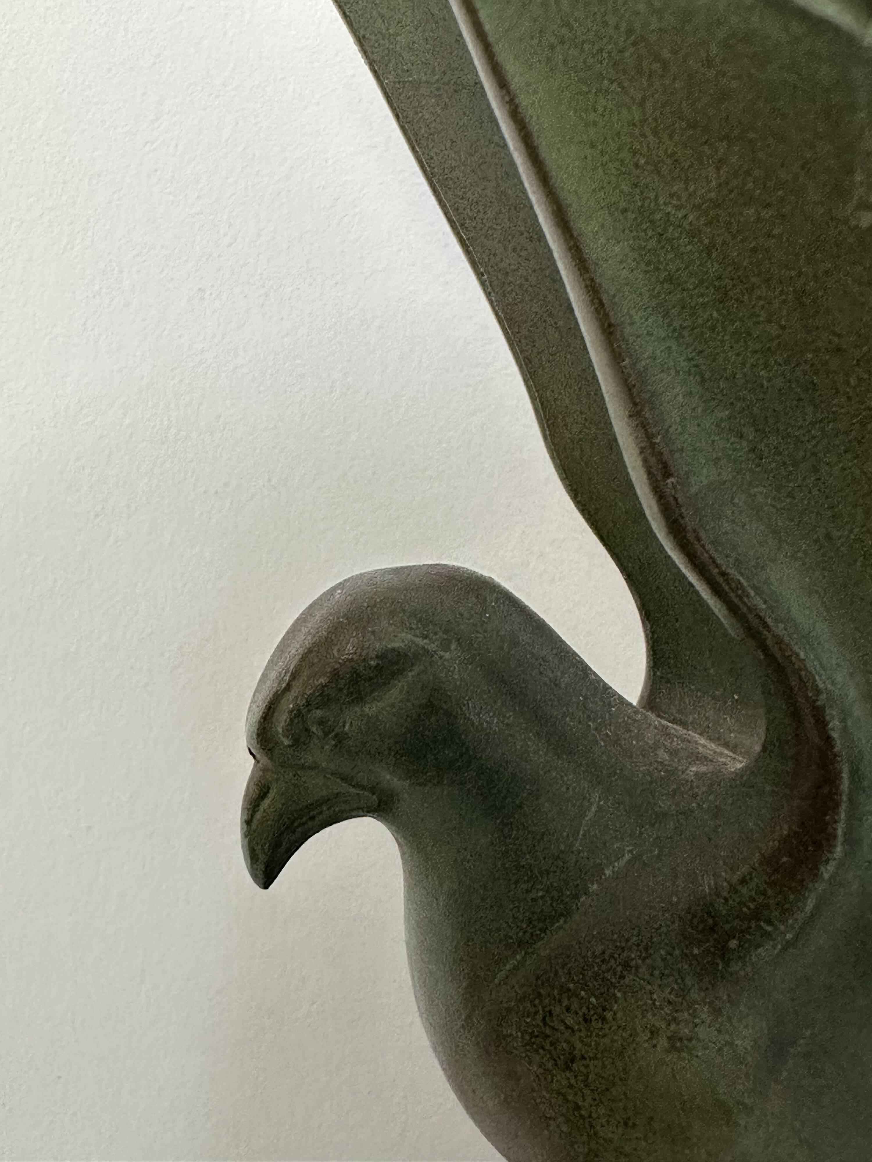 Pair of eagle bookends in green patina regula with rosewood base