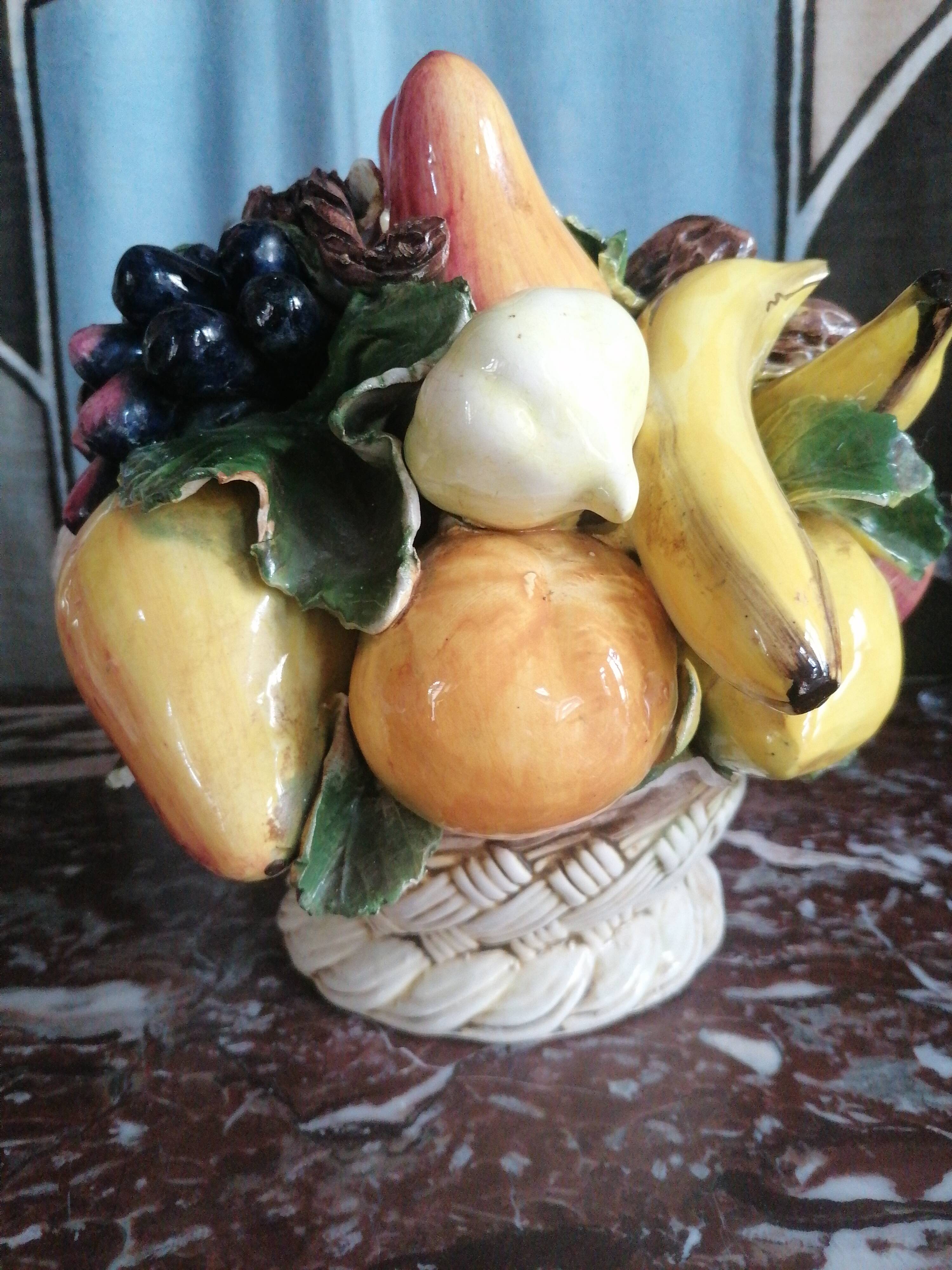 Basket with ceramic fruit decoration