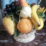 Basket with ceramic fruit decoration