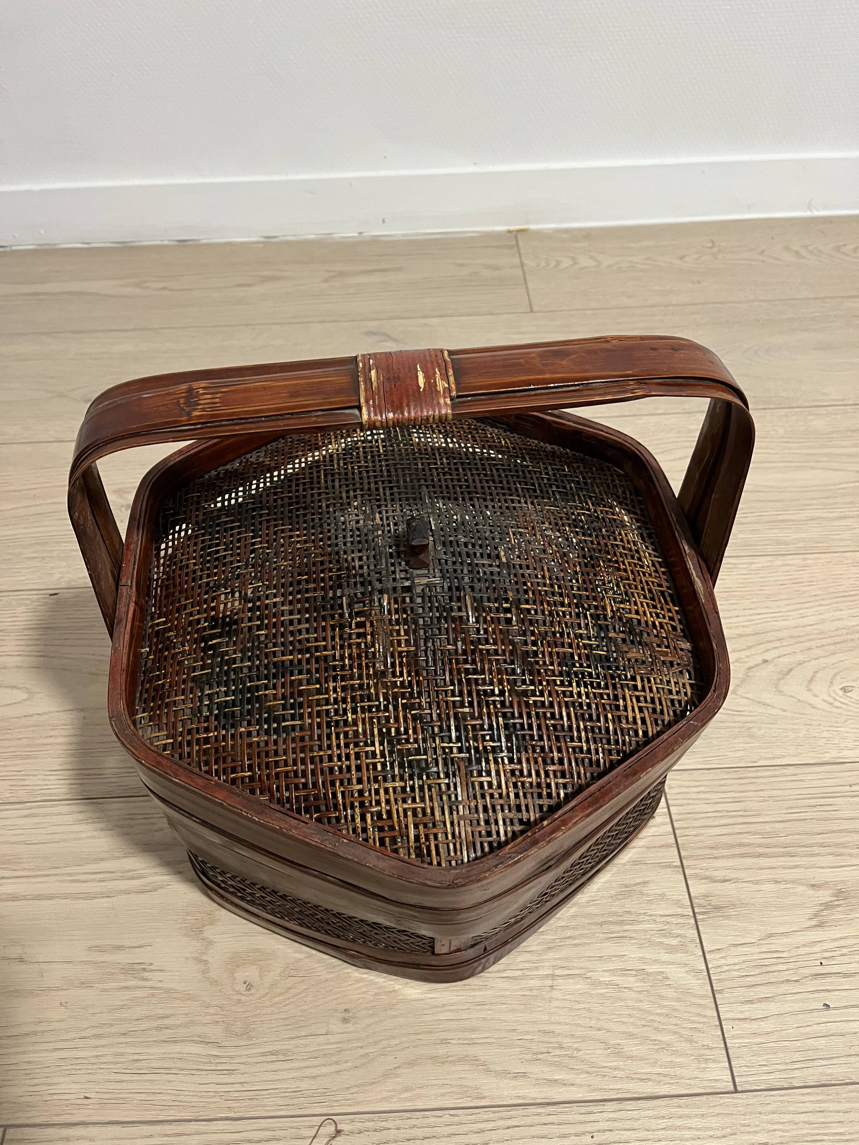 Ancient wooden and woven wicker basket,