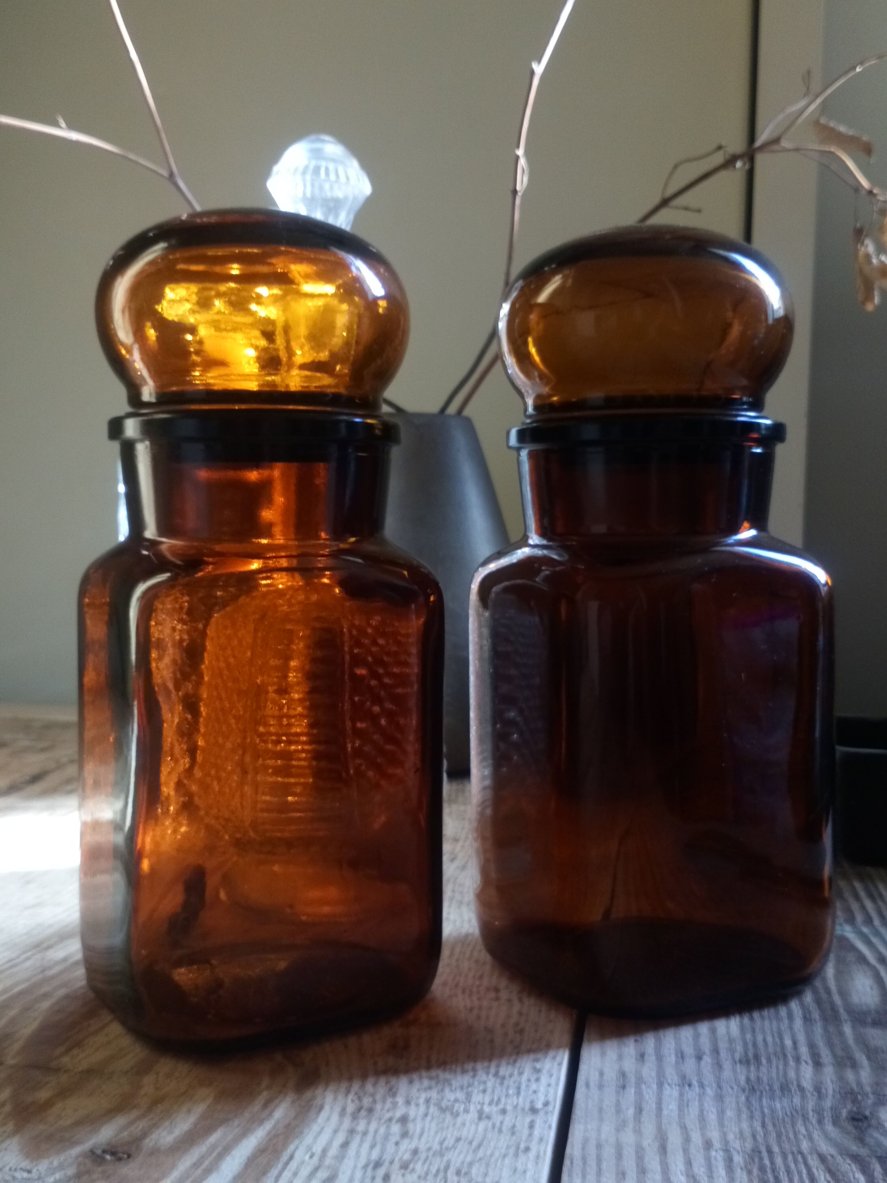 Duo of vintage apothecary bottles in amber glass
