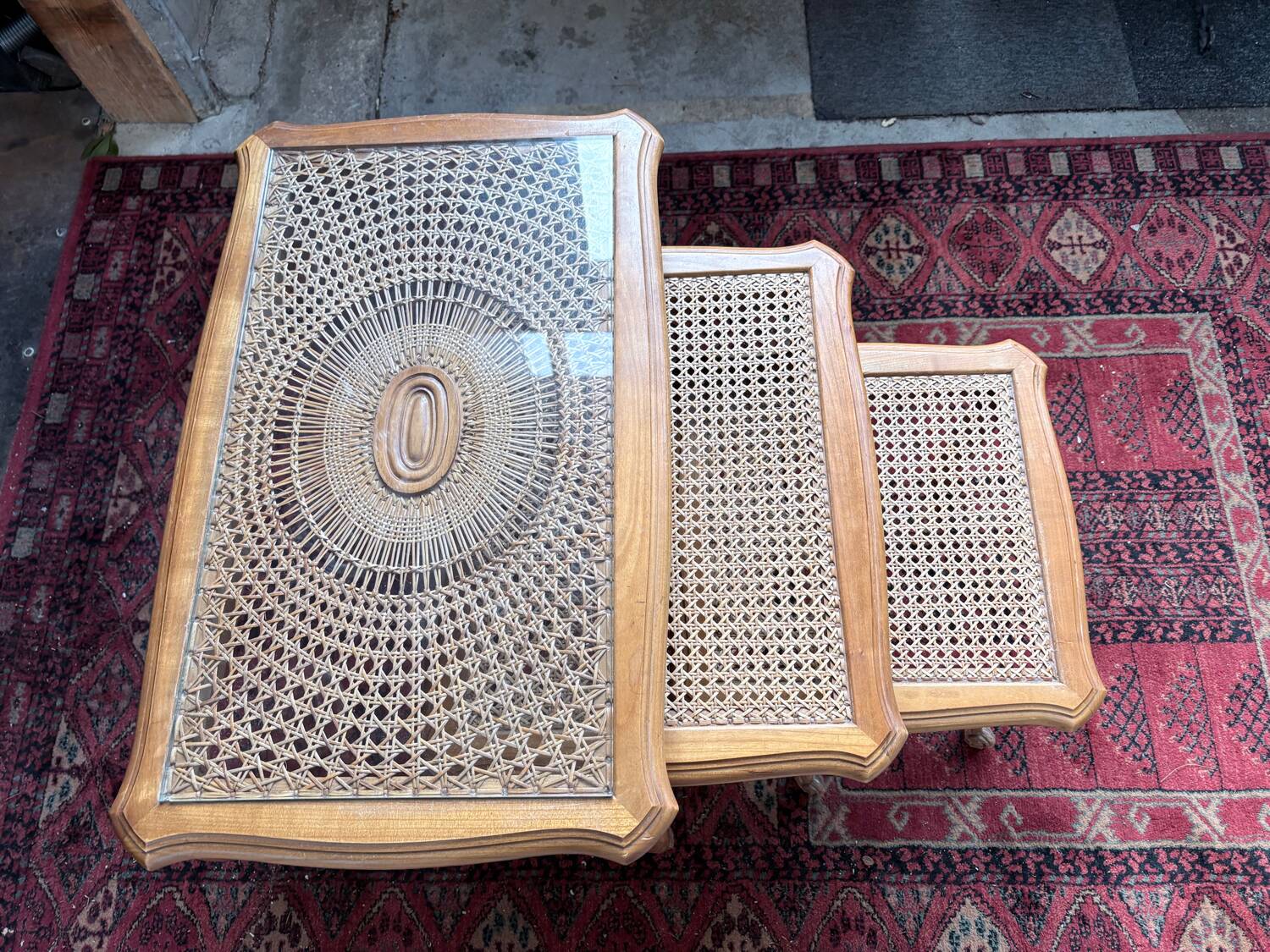 Vintage nesting tables in wood and cane – perfect condition.