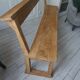Church bench, bed end in pitch pine with light oak wax finish.