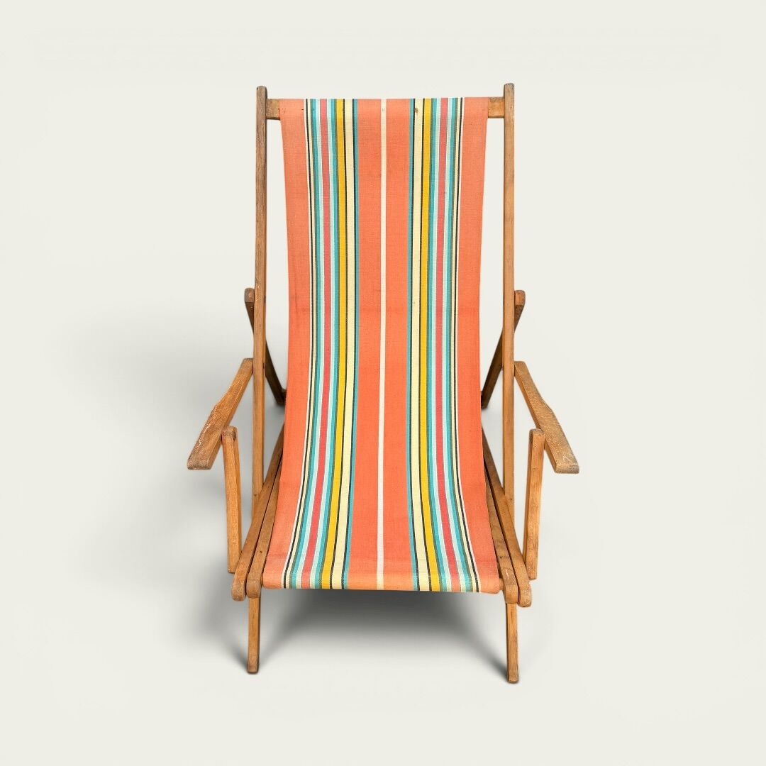 Vintage striped multicoloured deck chair with original patina.