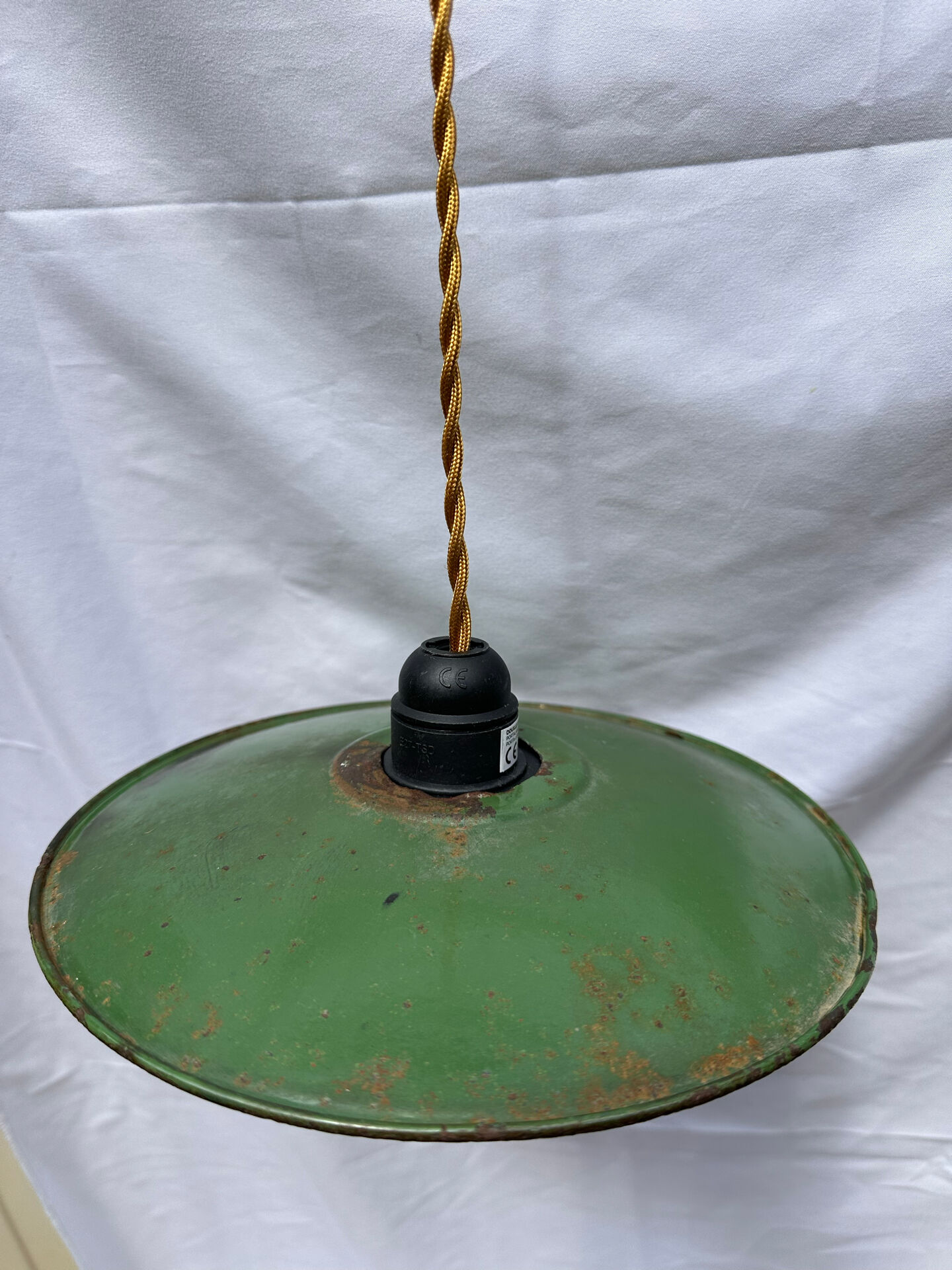 Old green and white enamelled sheet metal suspension