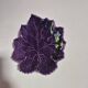 purple ceramic bowl in the shape of a tree leaf