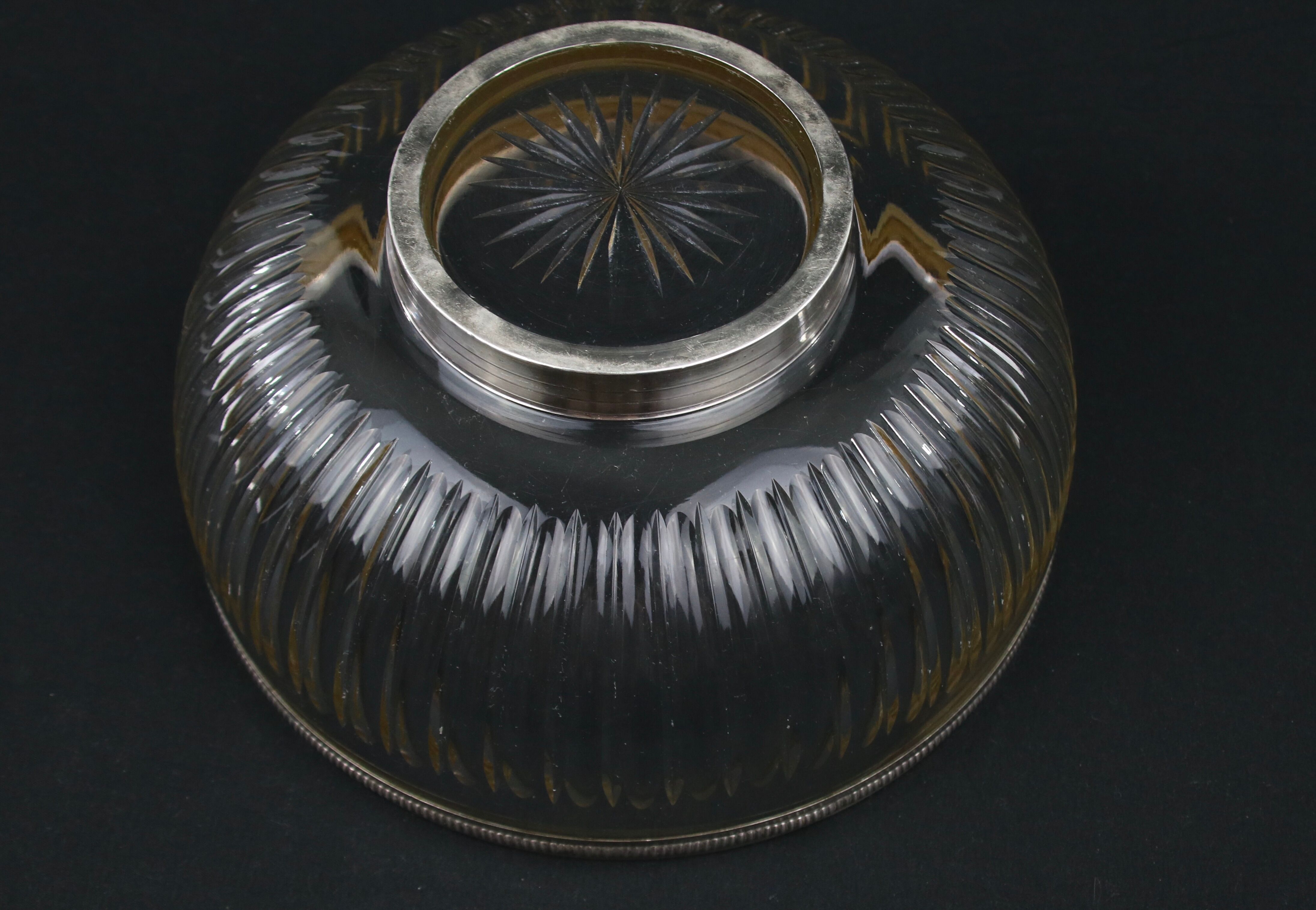 Crystal cup surrounded by two silver friezes