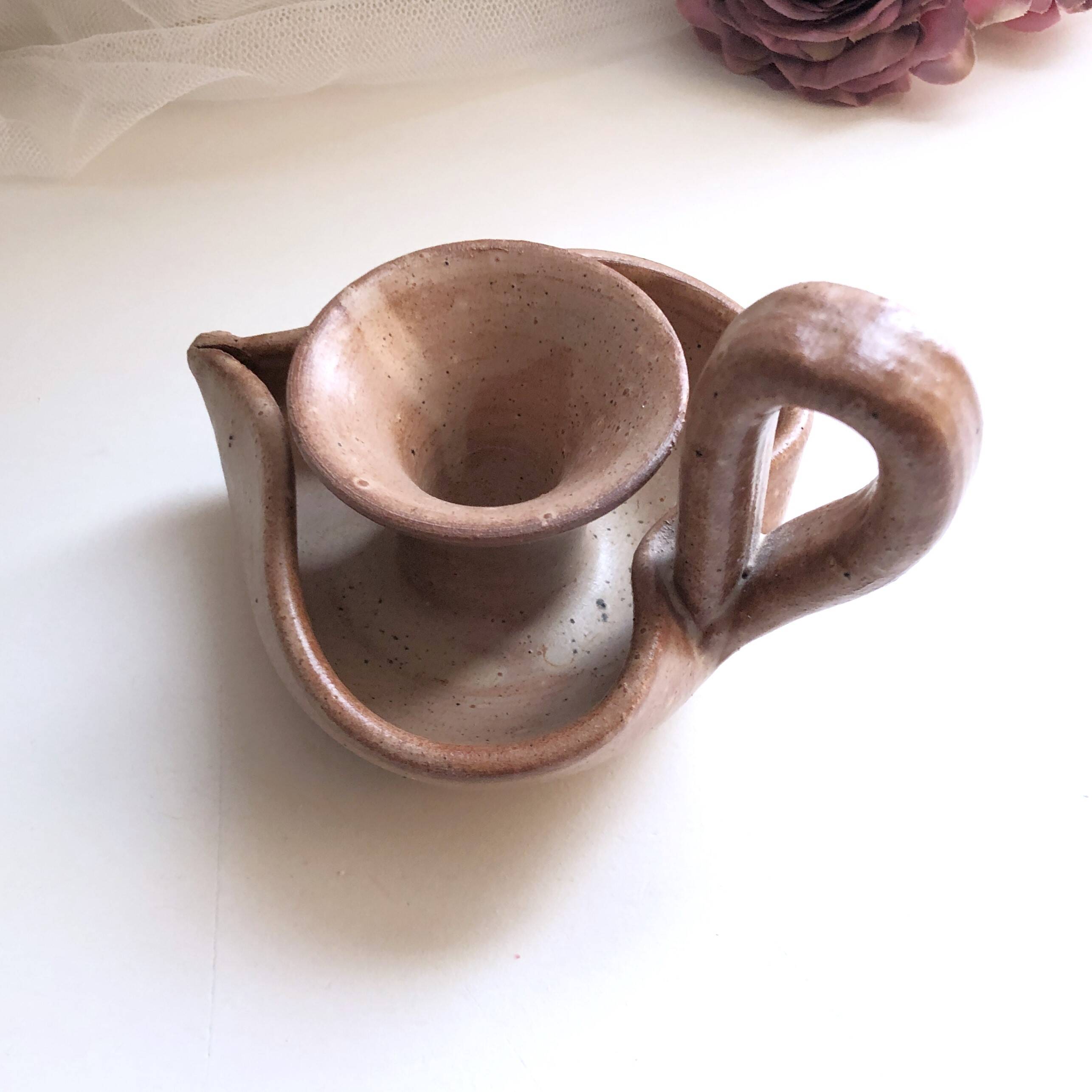 Glazed stoneware heart-shaped hand candle holder