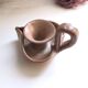 Glazed stoneware heart-shaped hand candle holder