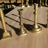 Set of 4 old candle holders in golden brass