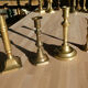 Set of 4 old candle holders in golden brass