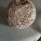 Globe suspension made of twine and wicker