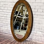 Oval beveled wooden mirror, 93x54 cm