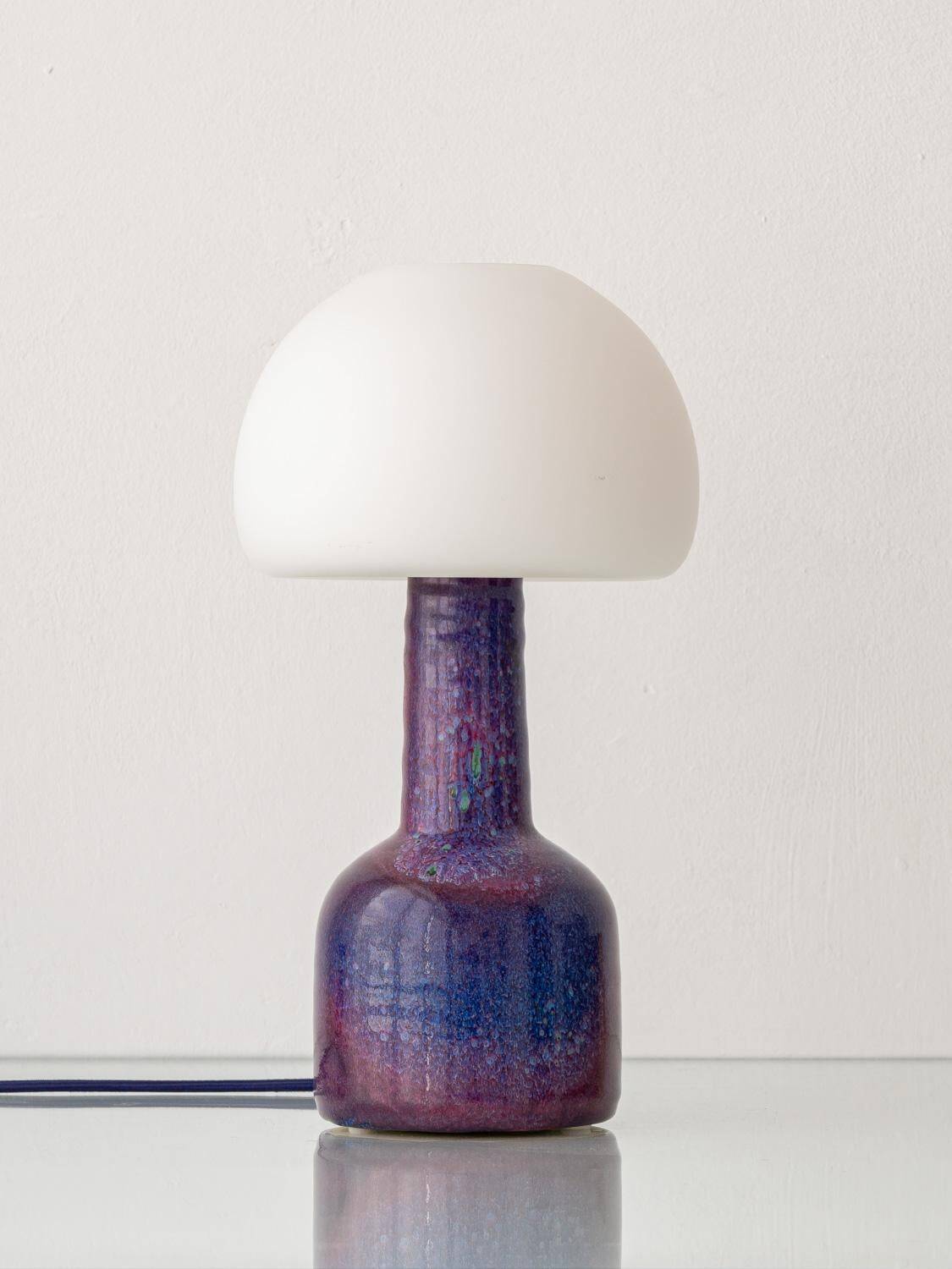 Mid-century modern table lamp by Jaap Ravelli, ceramic base and glass shade.