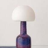 Mid-century modern table lamp by Jaap Ravelli, ceramic base and glass shade.
