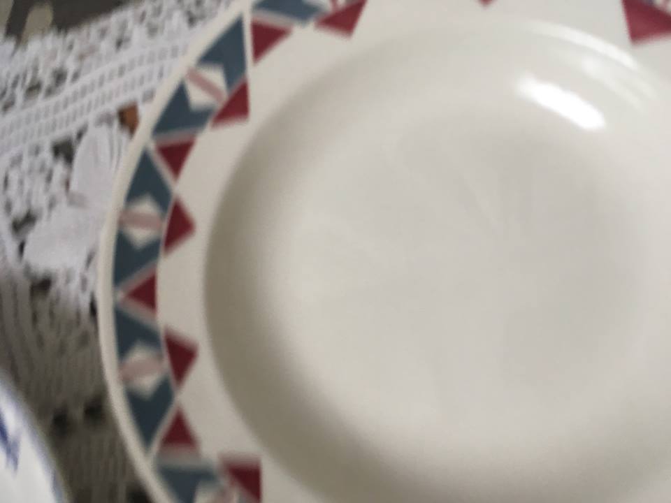 Six soup plates don't match in red and blue