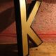 Teaches letter K vintage gold outlined in black format 15 x 21 cm