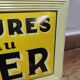 Tôle publicitaire apéritif anisé midi...7 heures l'heure du berger