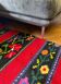 Romanian wool rug, red background with delicate colourful flowers