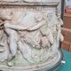 Round white stone pot cover with a farandole of angels