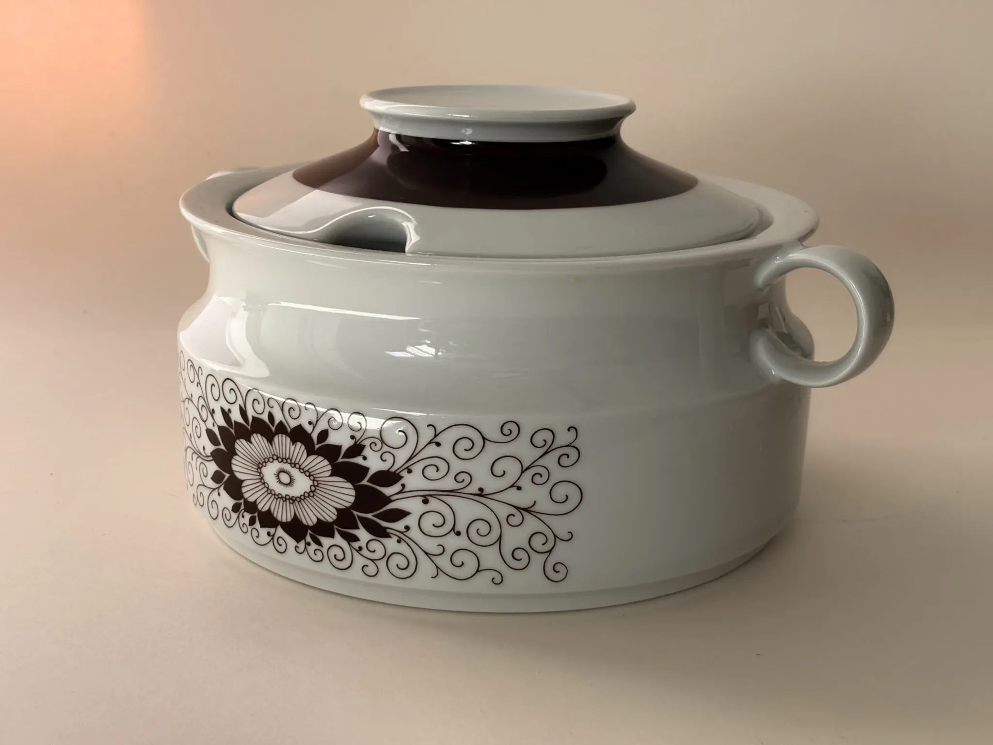 Porcelain soup tureen by Winterling, decorated with brown flowers.