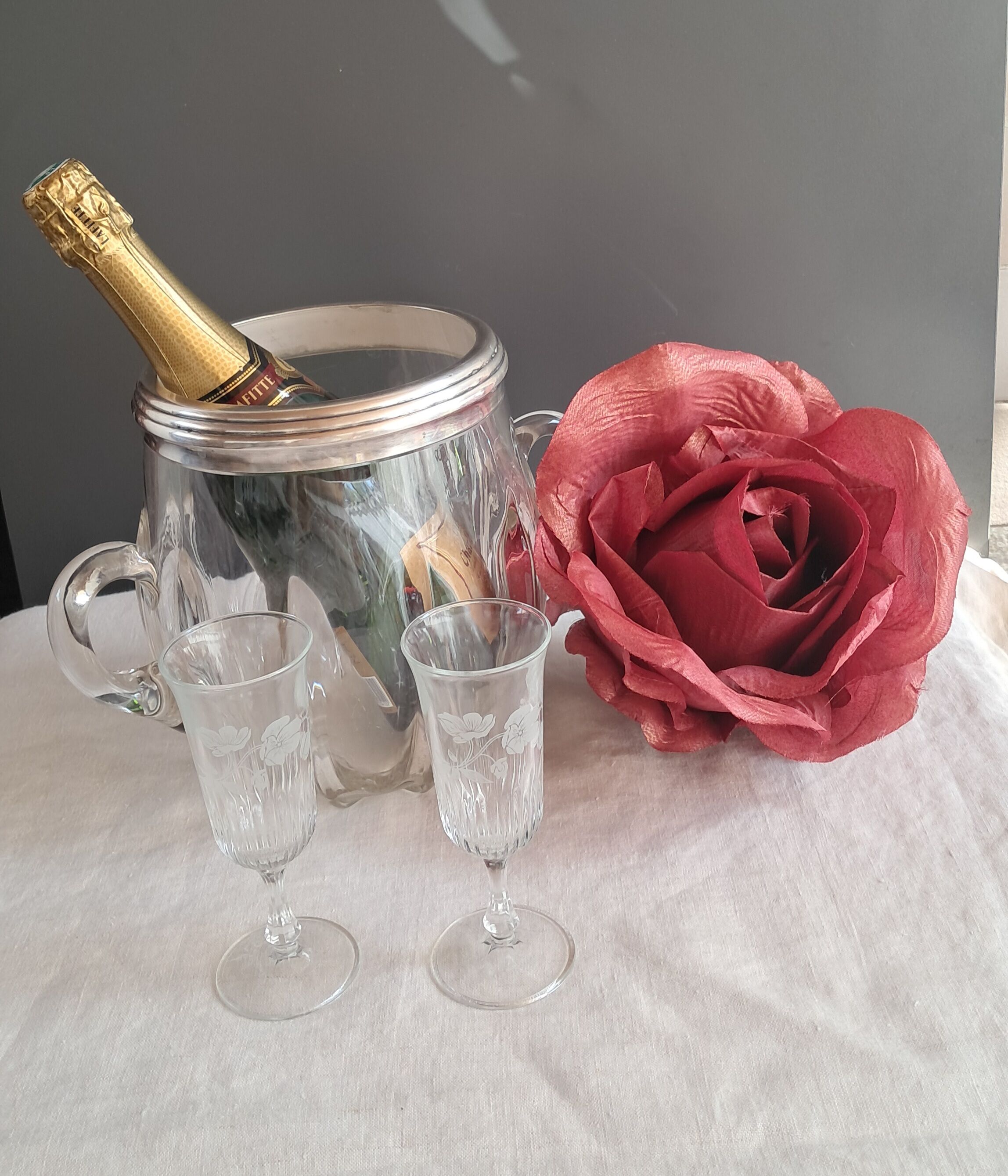 Twisted moulded glass bistro champagne bucket with a silver metal collar.