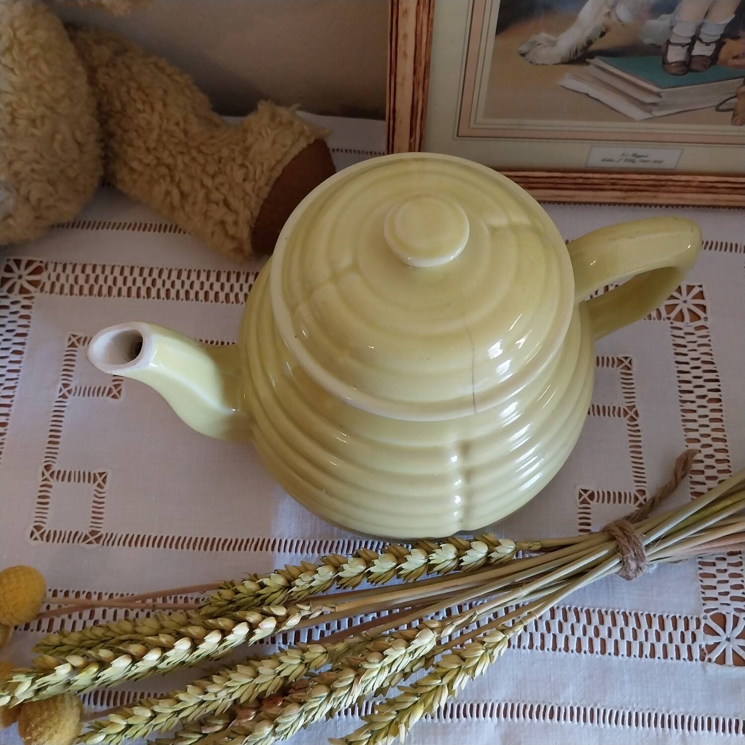 Old yellow earthenware teapot