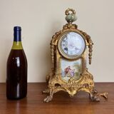 Napoleon III clock in gilded bronze and porcelain plates decorated and painted by hand