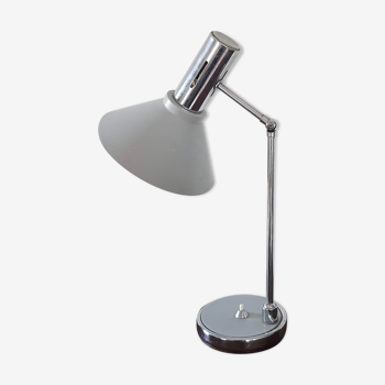 Chrome metal desk lamp and gray articulated arm