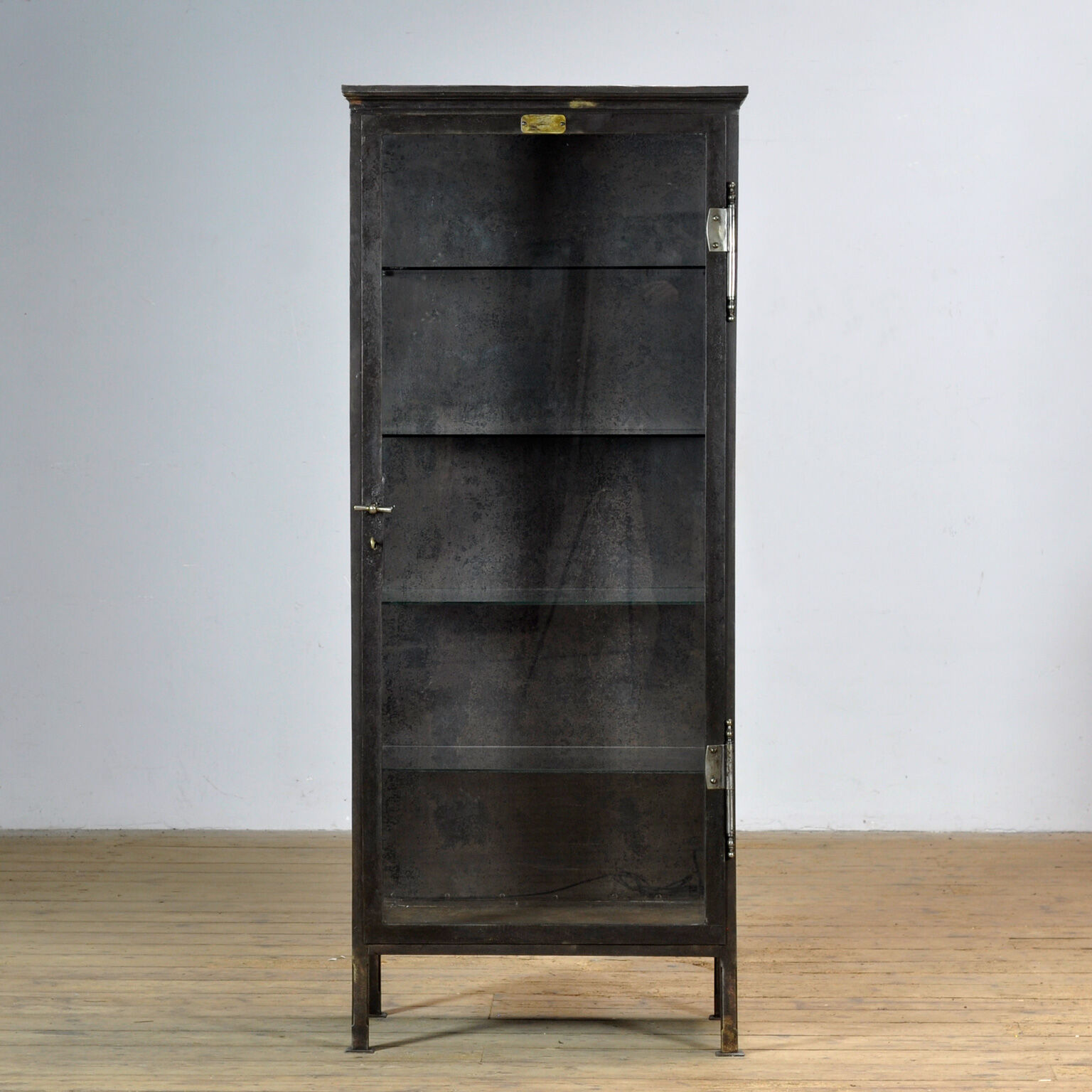Polished iron medical cabinet, 1910s