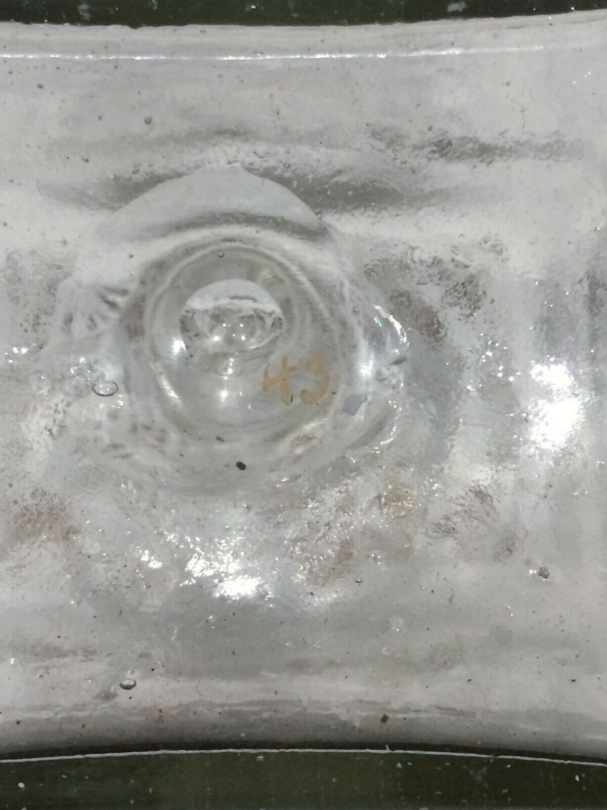 Glass bottle decorated with gold motifs