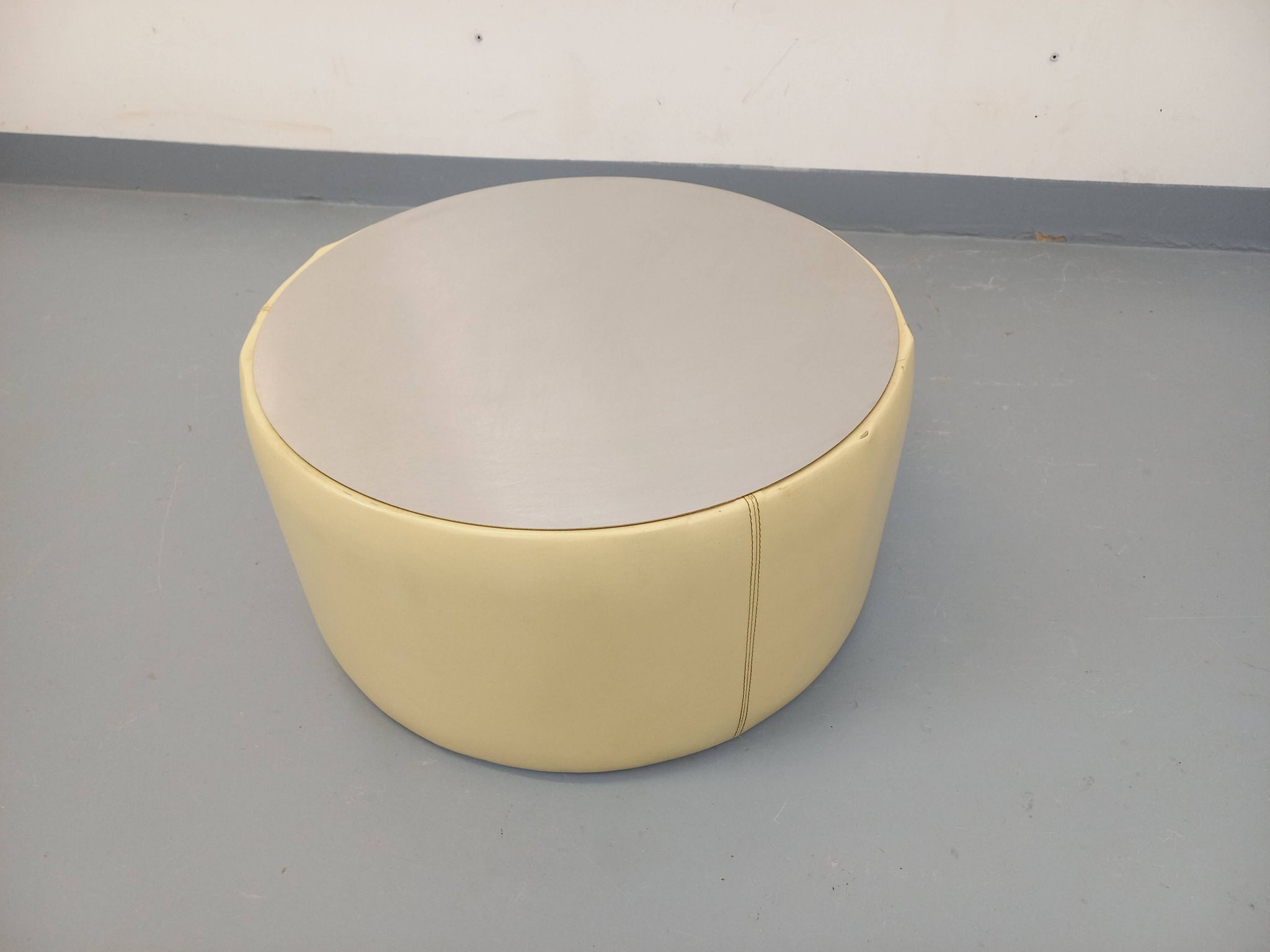 Vintage round coffee table in glass, leather, and metal in Space Age style from the 70s.