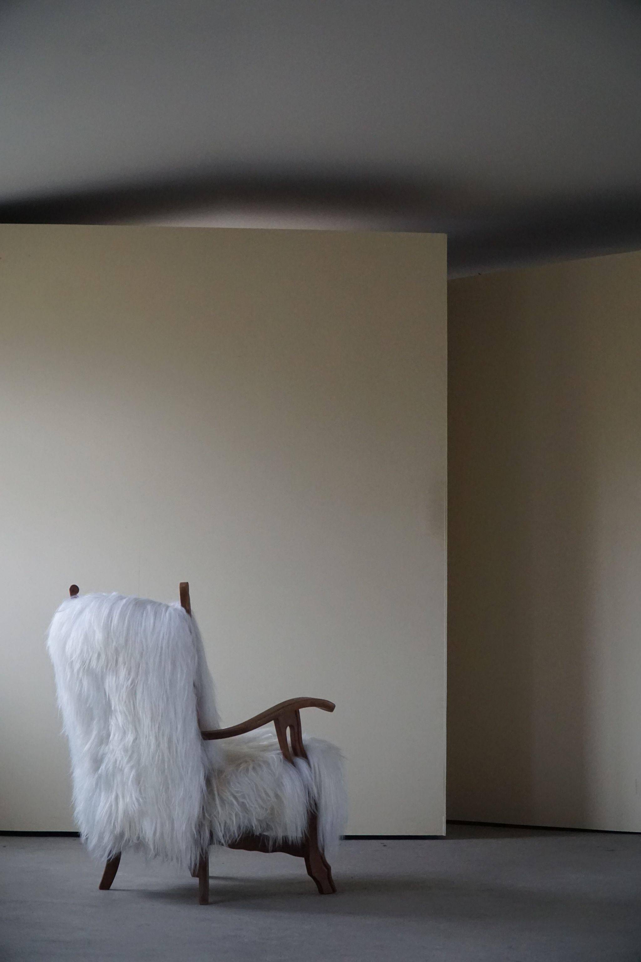 Henning Kjærnulf, armchair reupholstered in long-haired Icelandic sheepskin, 1950