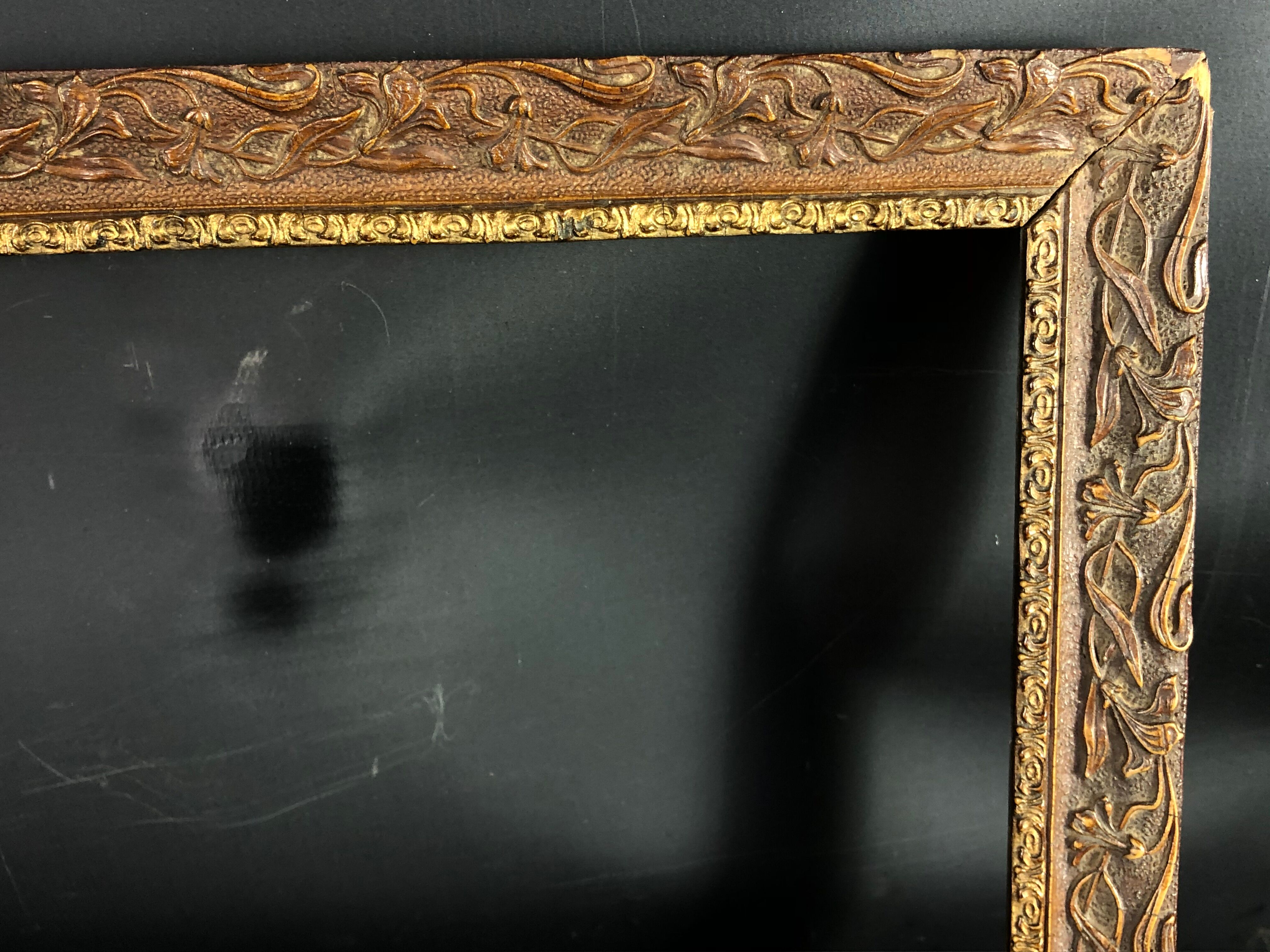 Old frame wood and stucco patinated and gilded