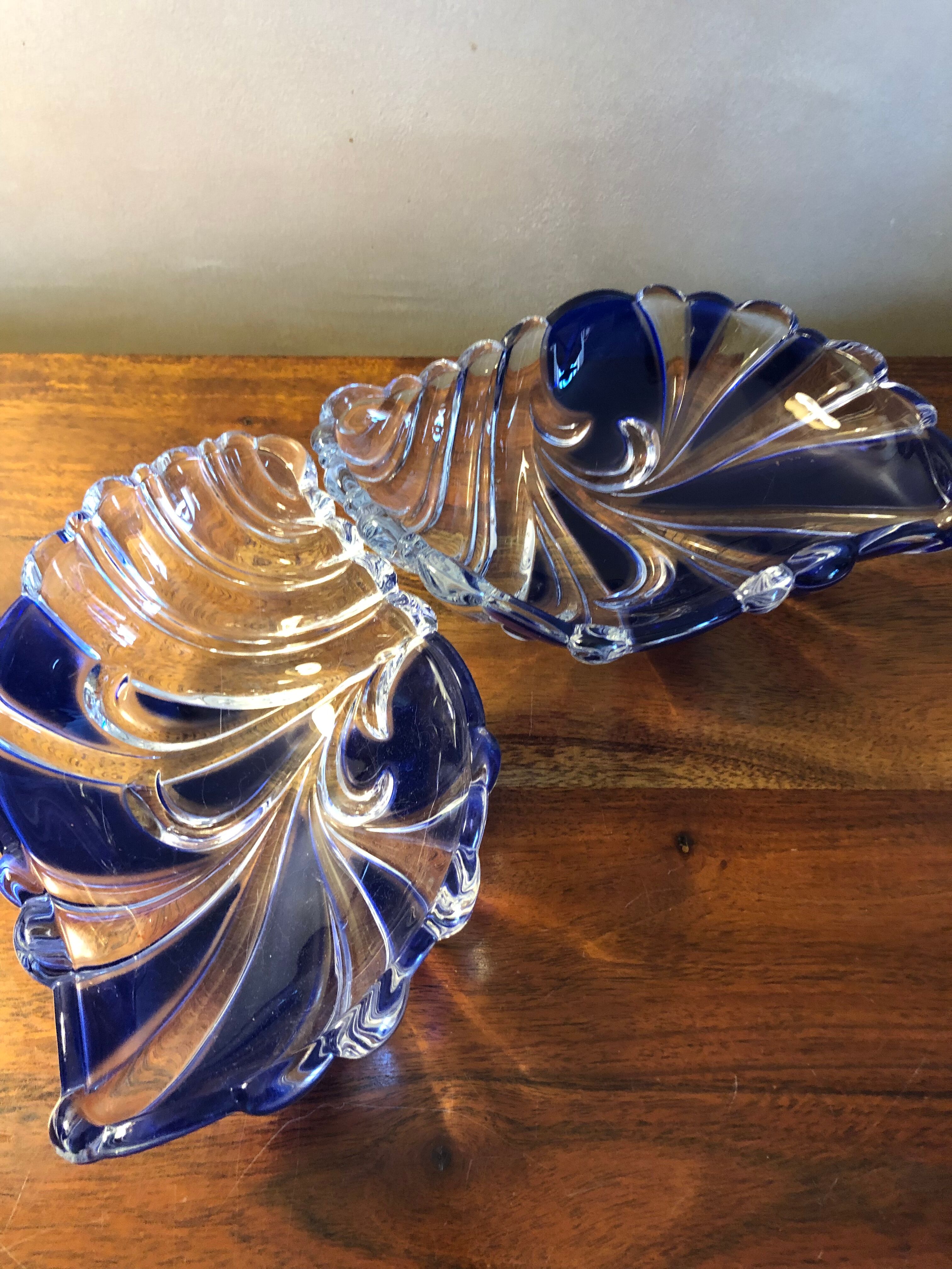 2 empty cups pocket blue colored glass shell pocket