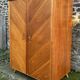 Mid-century wardrobe from the 1960s in wood, with a chevron front and tapered legs.