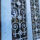 Entrance door in solid oak, cast iron grille, 1930s