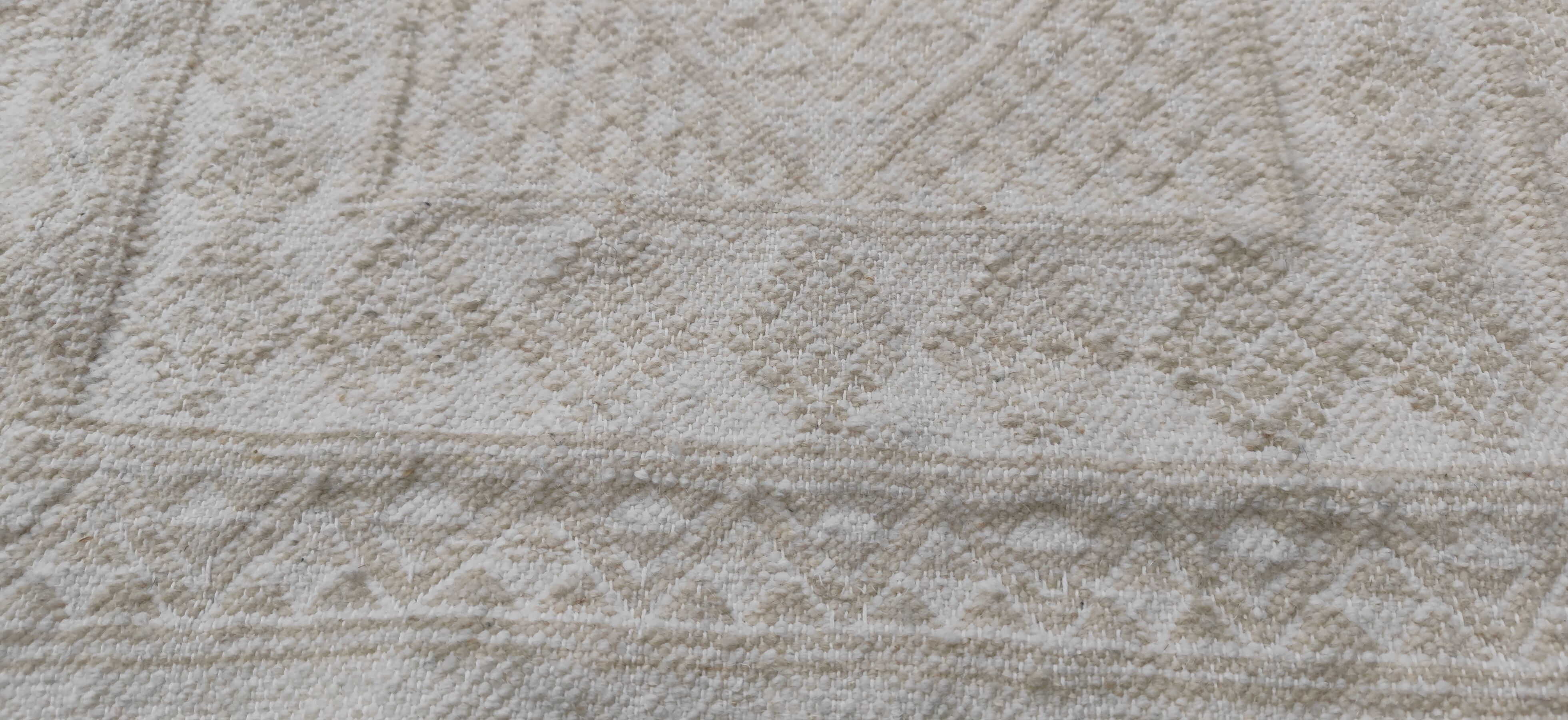 Hand-woven rug in natural wool