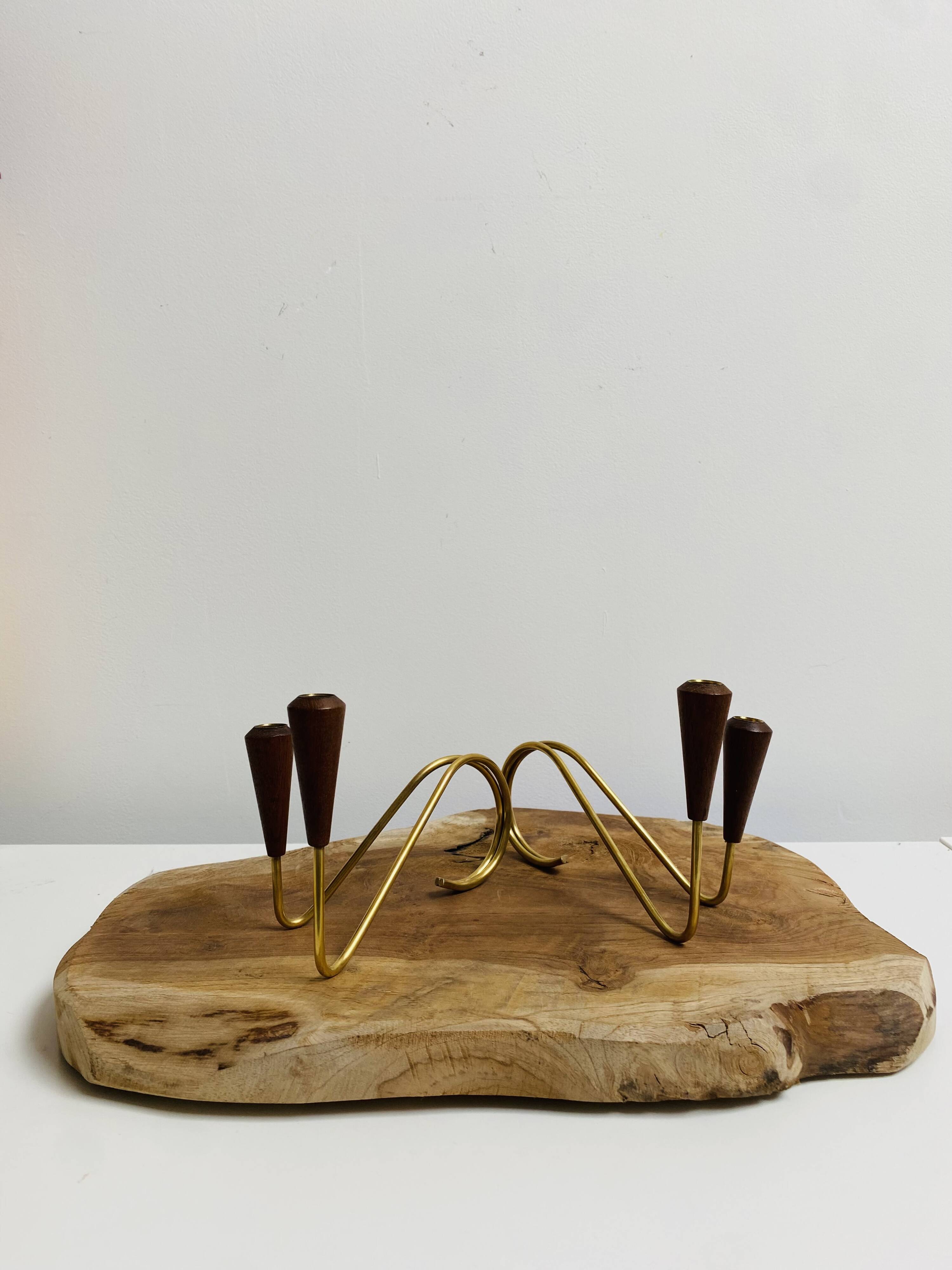 Pair of teak and brass candlesticks
